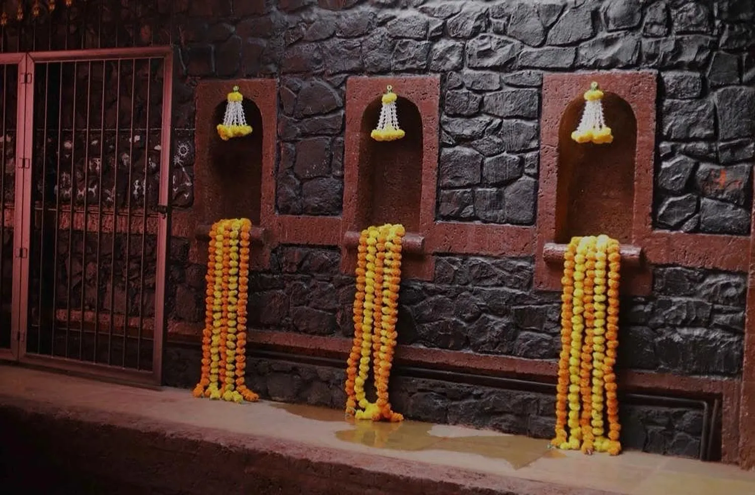 Garlanded basalt niches — ShivBhumi